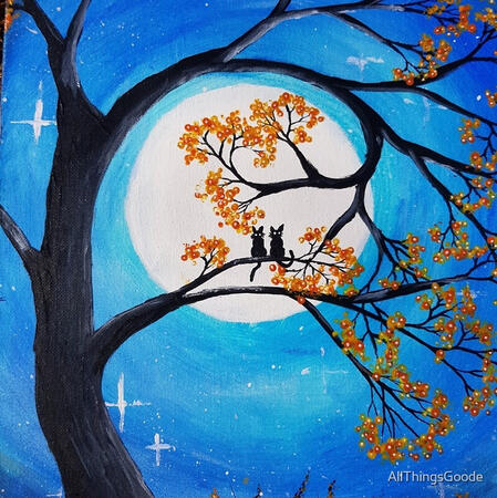 Two cats on tree at midnight